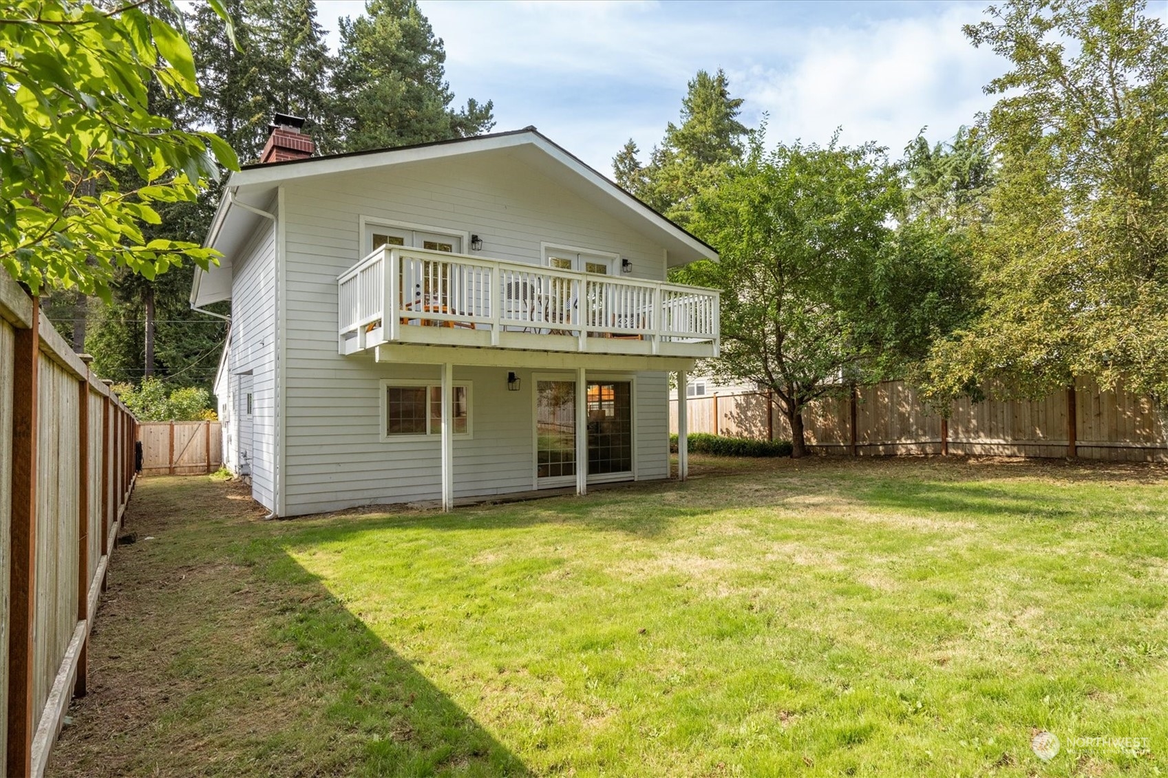 a view of a house with a yard and garage