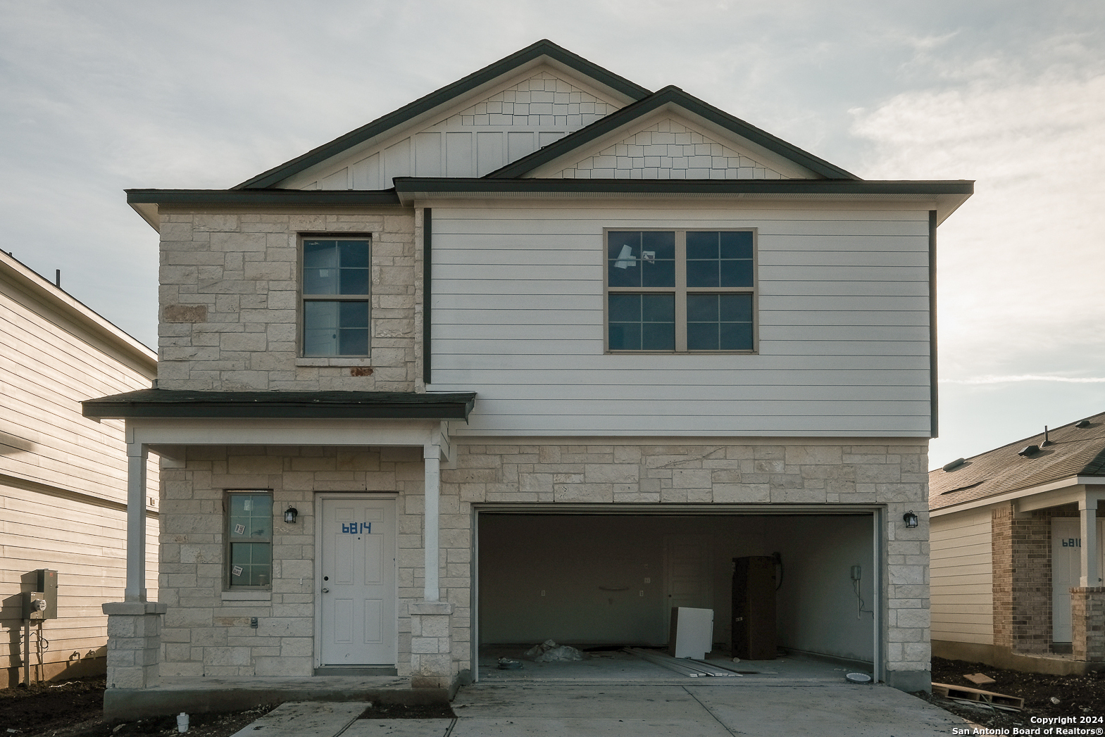 a front view of a house with yard