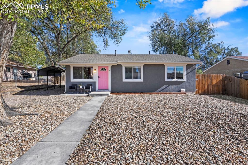 View of front of property featuring a carport