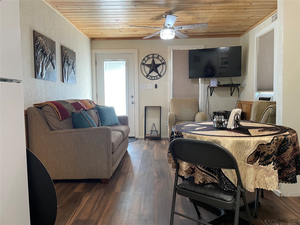 a living room with fireplace furniture and a flat screen tv