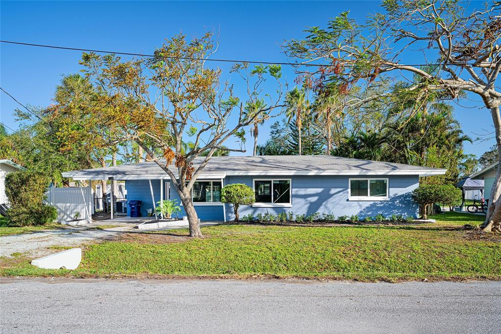 a front view of house with yard and green space