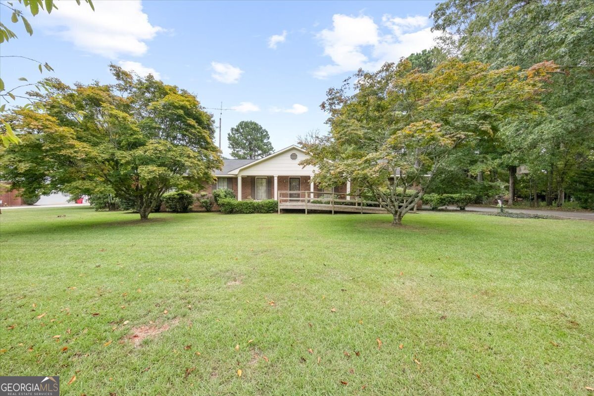 a front view of a house with a yard