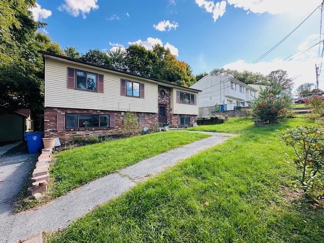 Split foyer home with a front yard