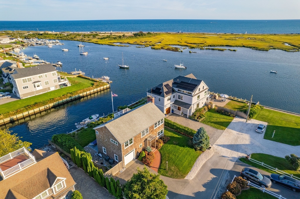 an aerial view of a house with a swimming pool