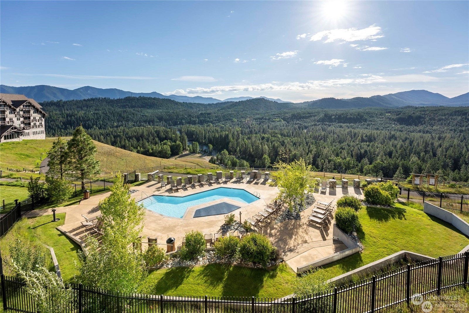 a view of a swimming pool with a lake view