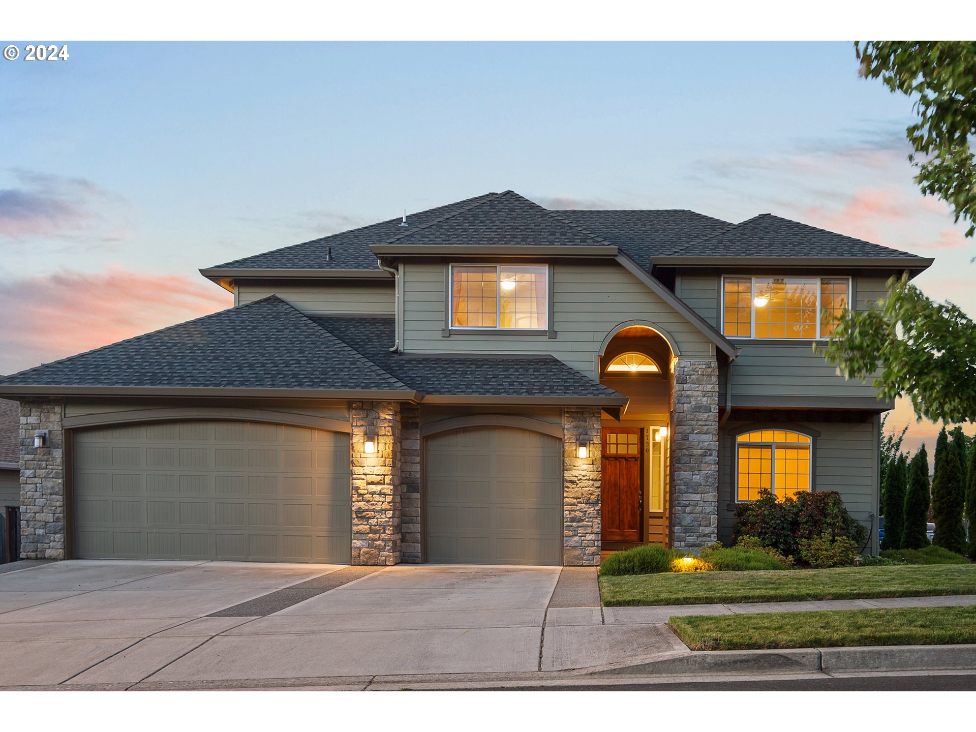 a front view of a house with a yard