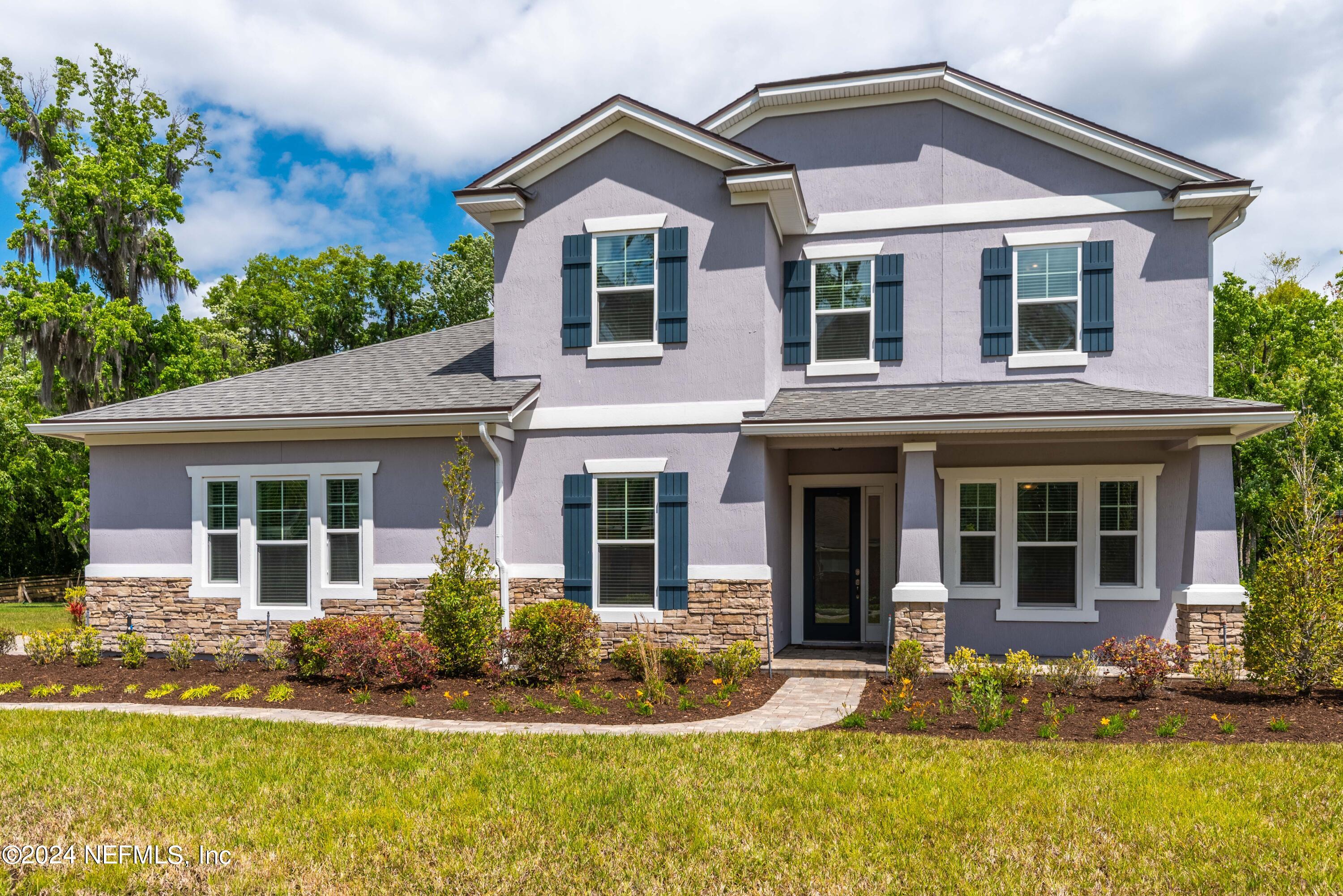 front view of a house with a yard