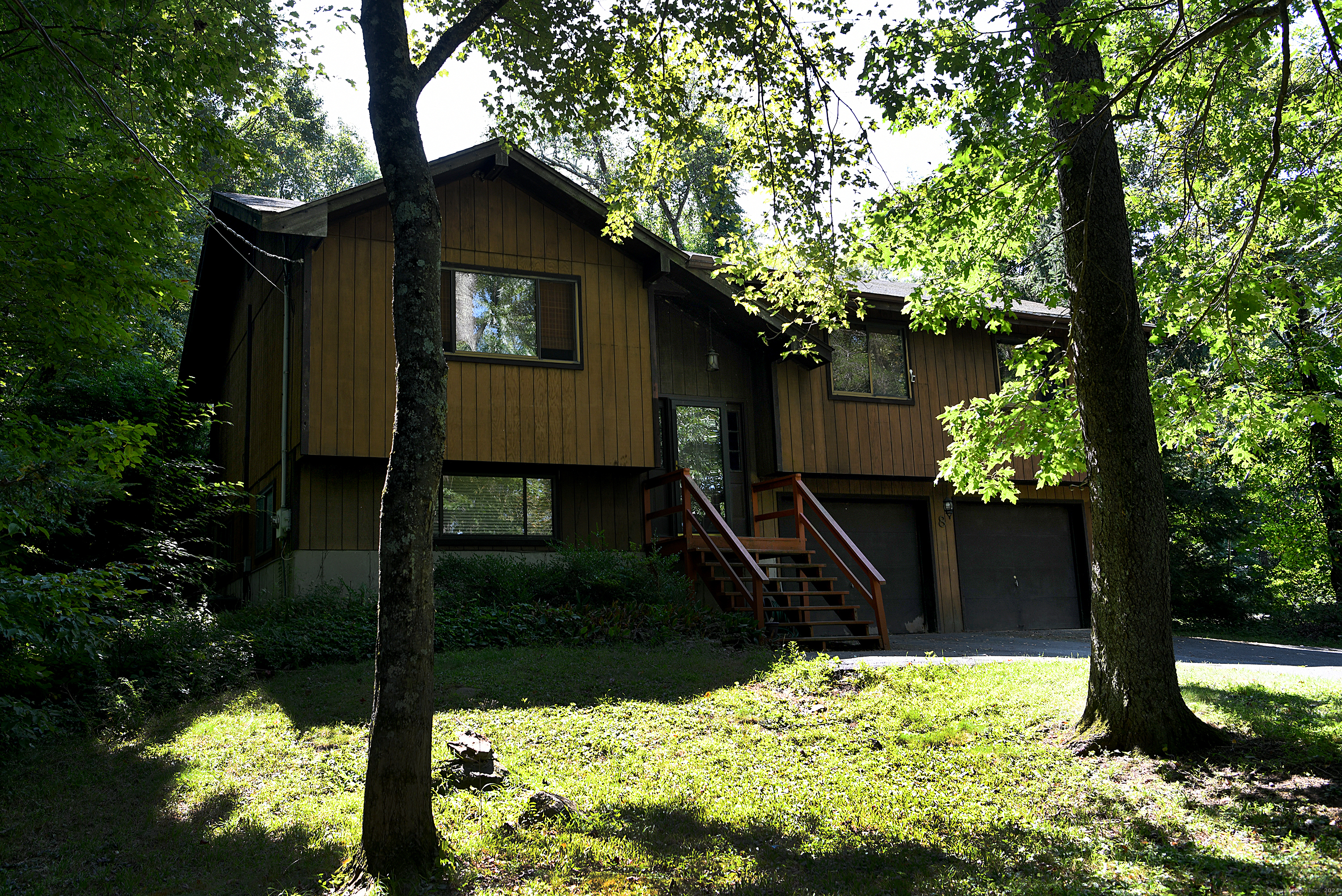 a backyard of a house with lots of green space