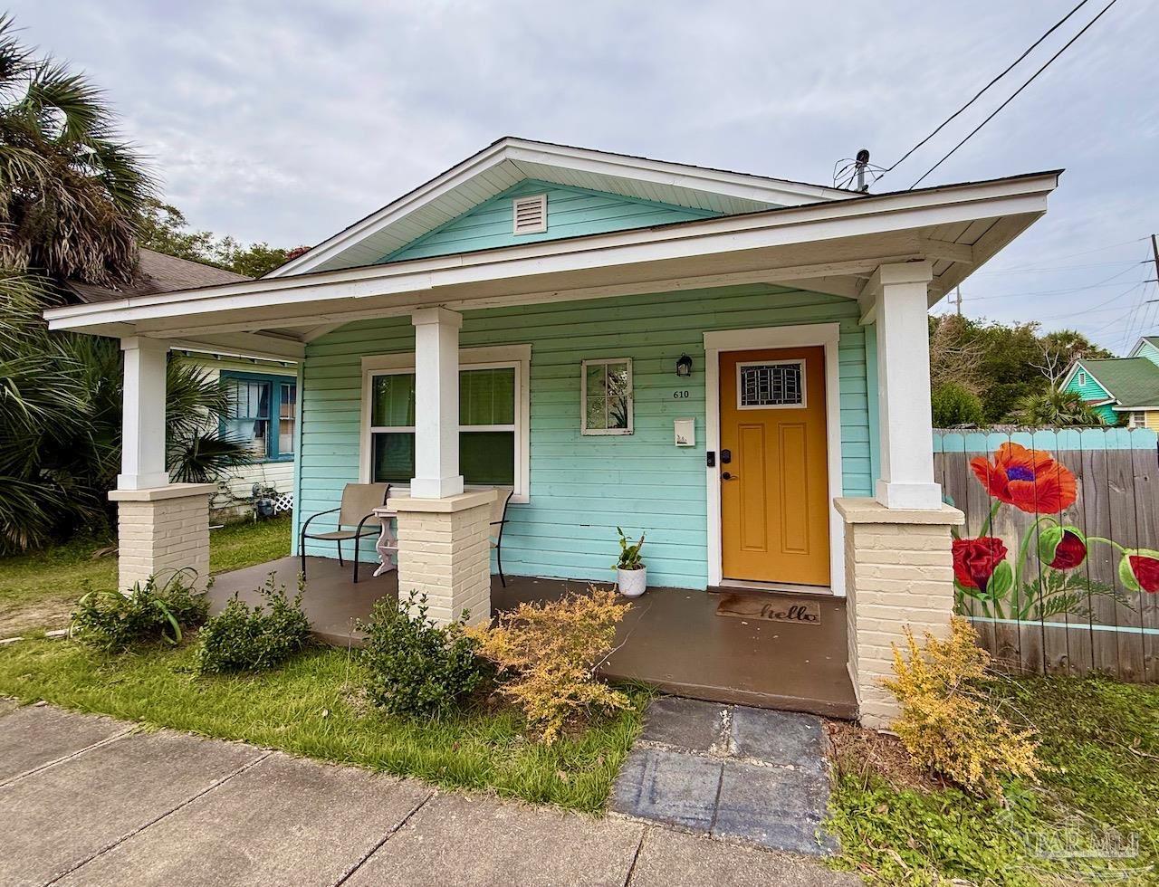 a front view of a house with garden