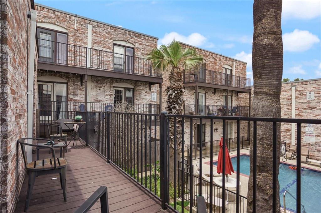 a view of a brick building from a balcony