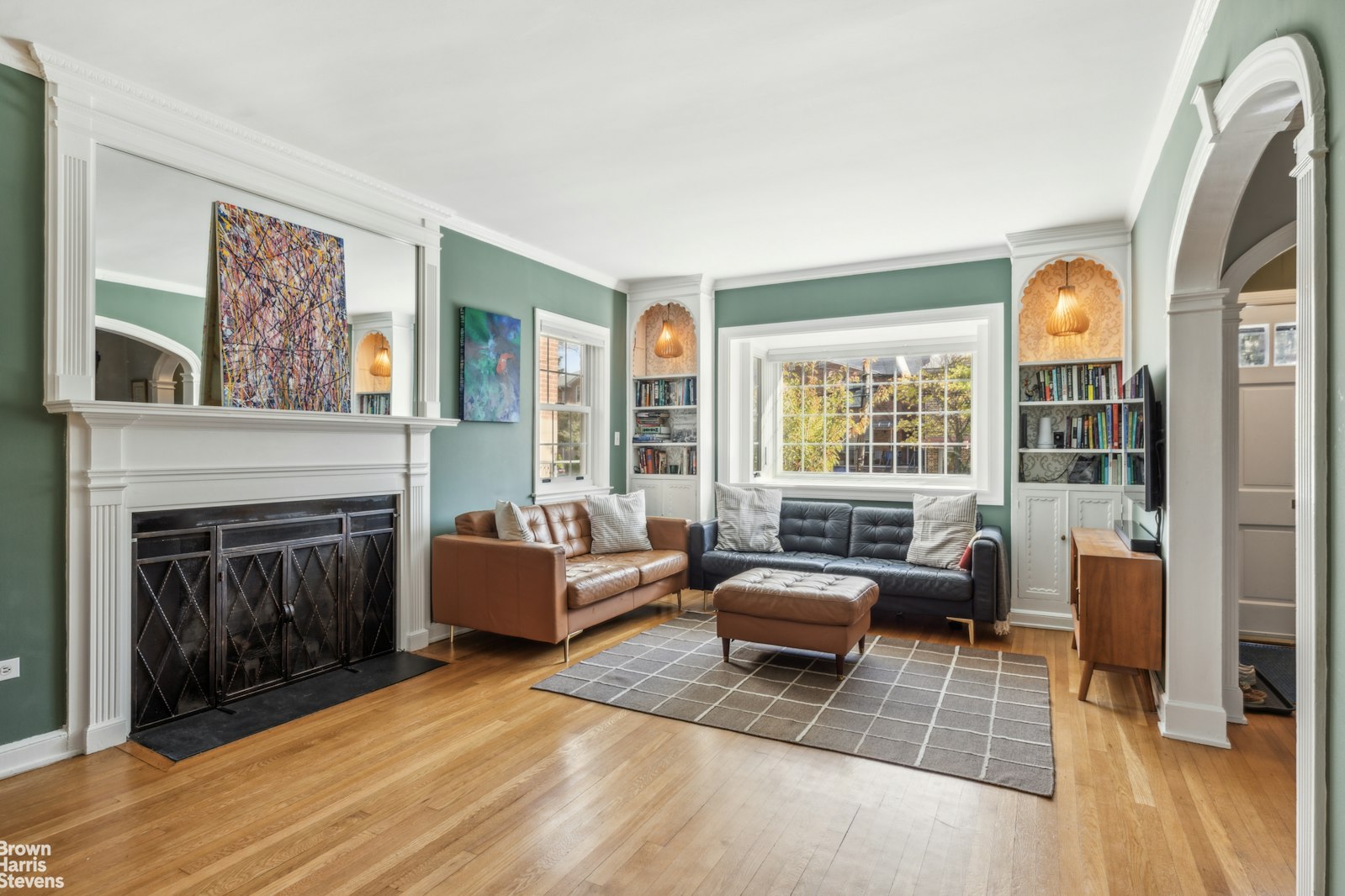 a living room with furniture and a fireplace