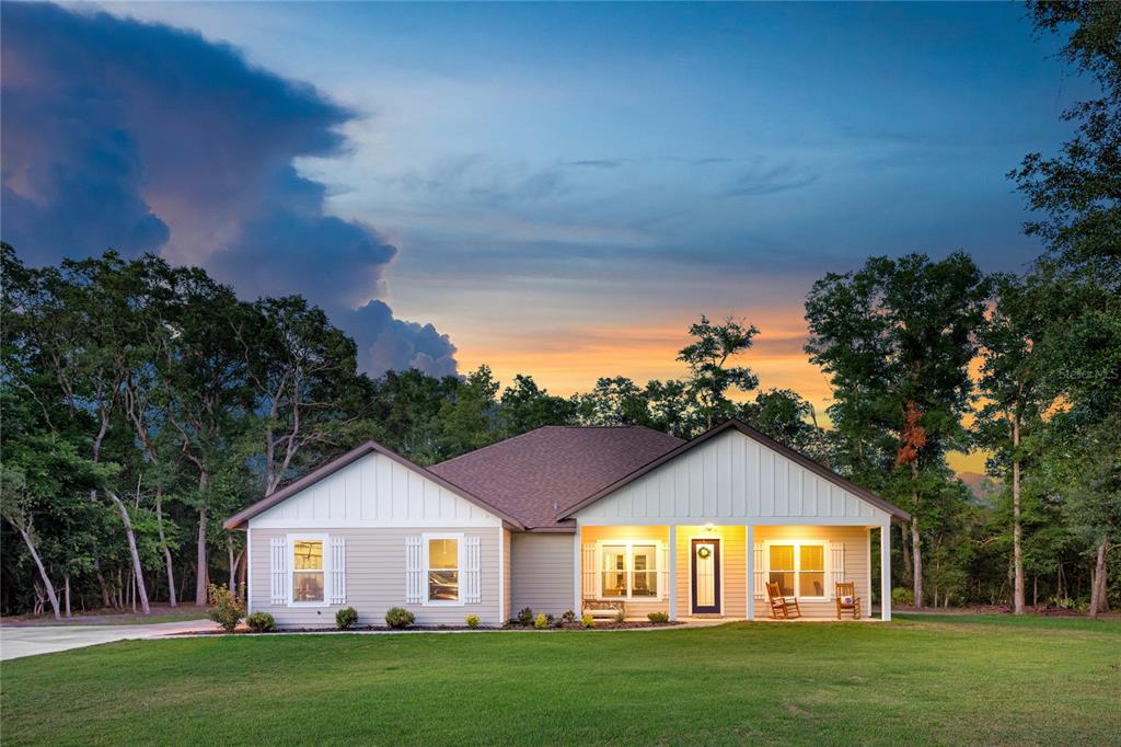 a front view of a house with a yard