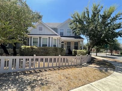 front view of a house with a small yard