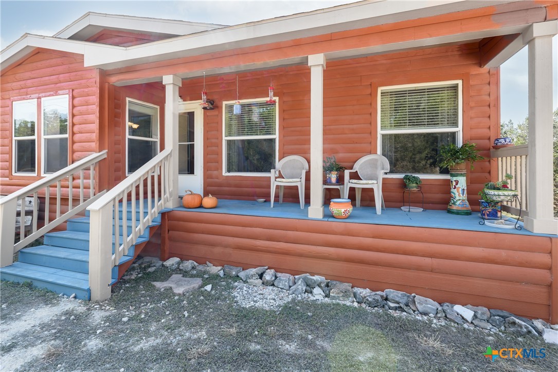 a view of balcony with furniture