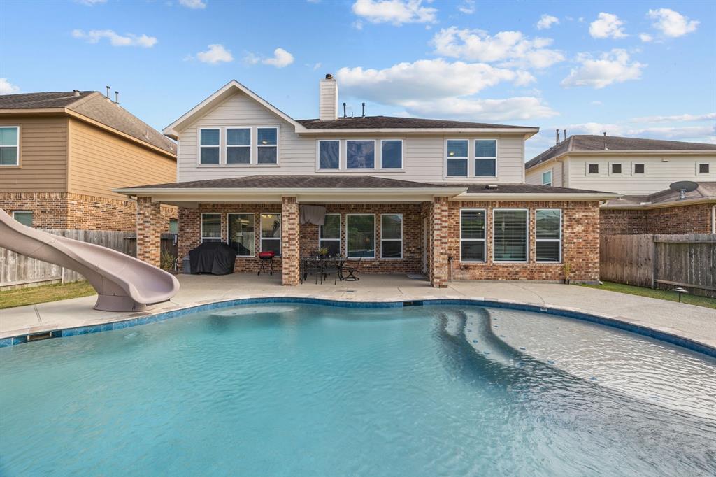 Experience your perfect retreat with this beautiful home, featuring a sparkling pool and expansive outdoor space.