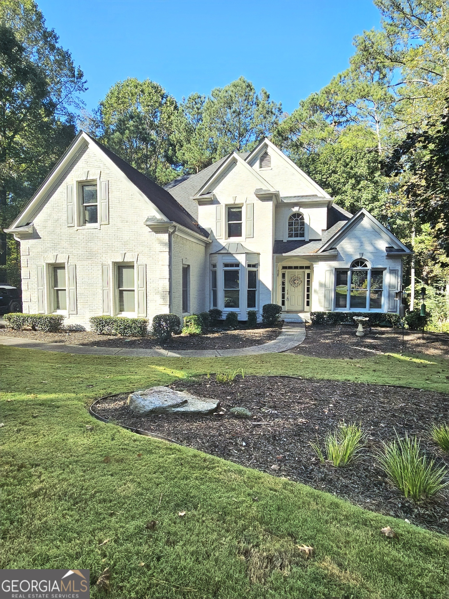 a front view of a house with a yard