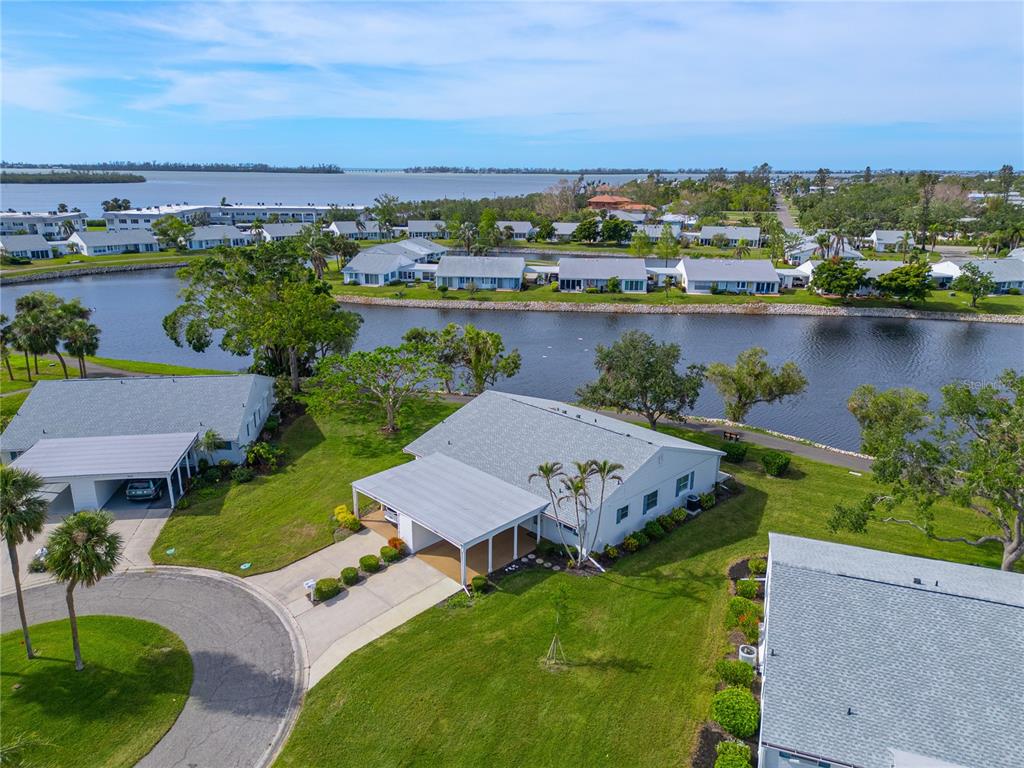 an aerial view of a house with a lake view