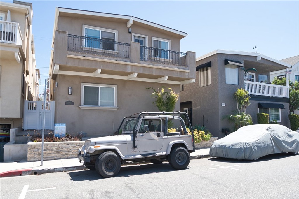 a view of a car parked in front of a building