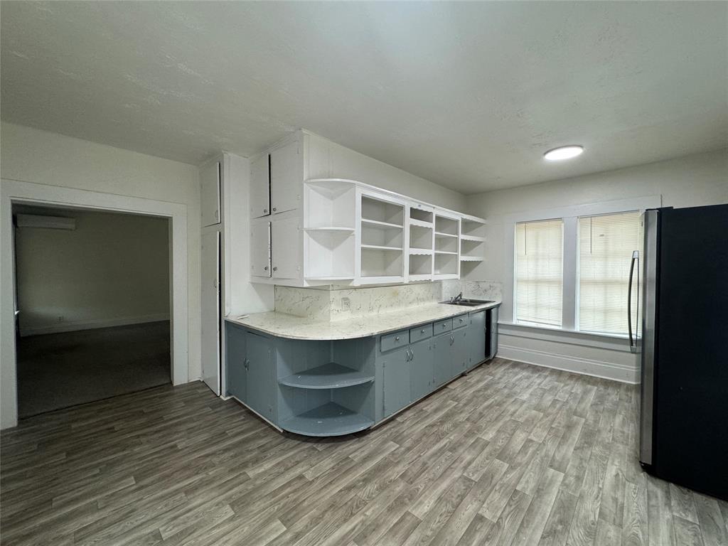 a kitchen with stainless steel appliances granite countertop a stove and a refrigerator