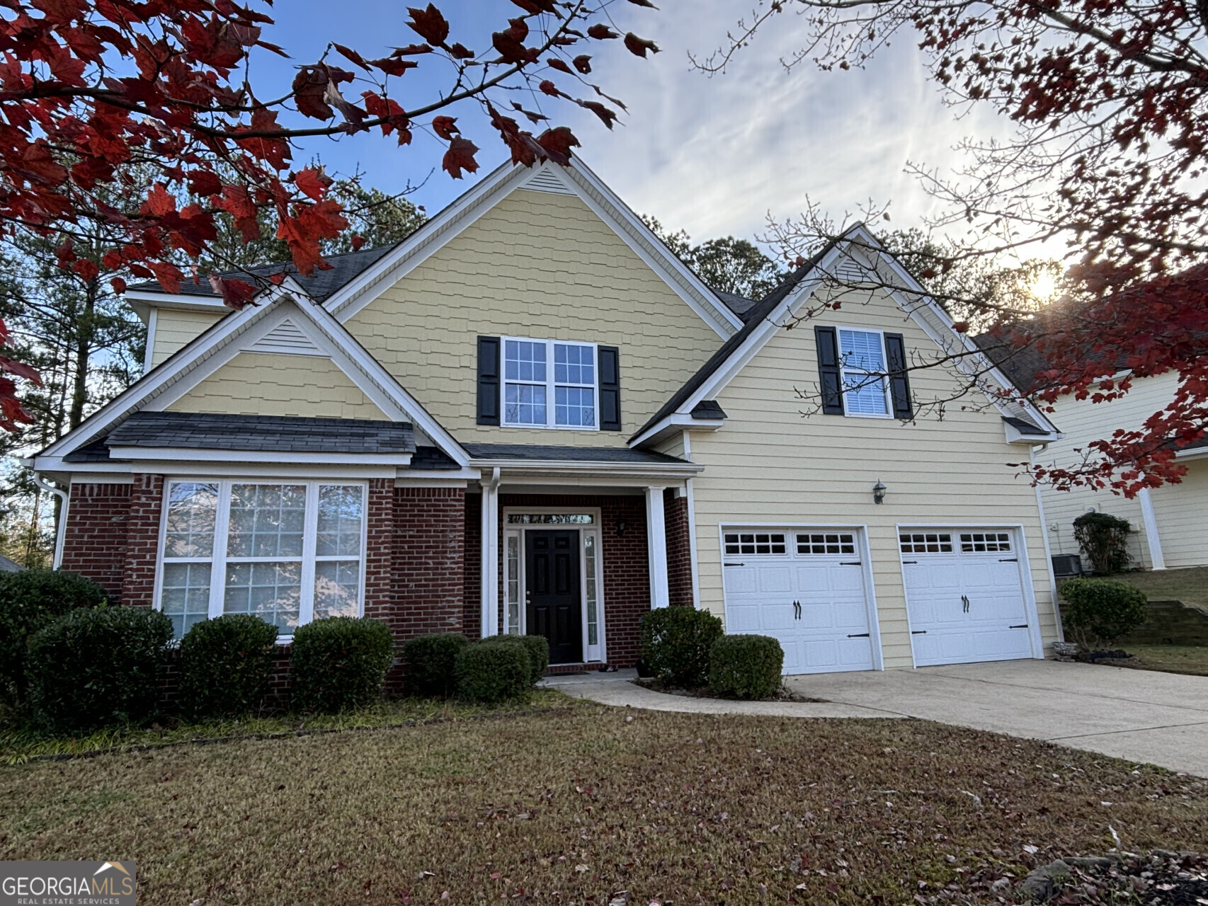 front view of a house with a yard