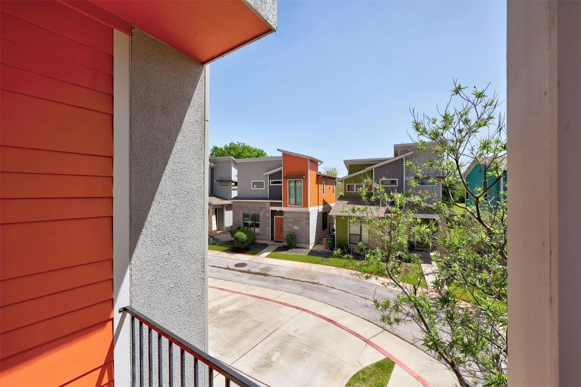 a view of a balcony with a tree