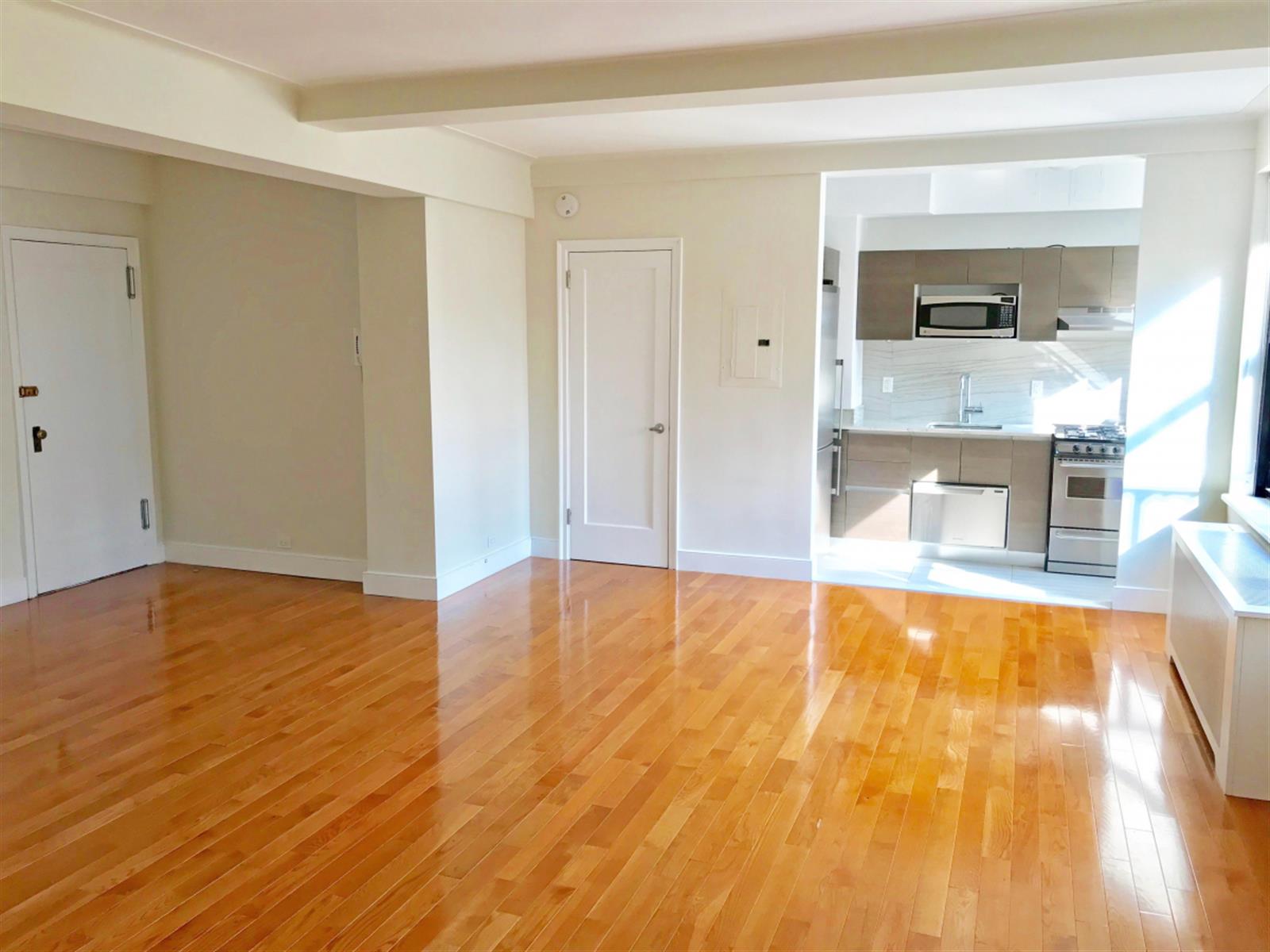 a view of a living room with a flat screen tv