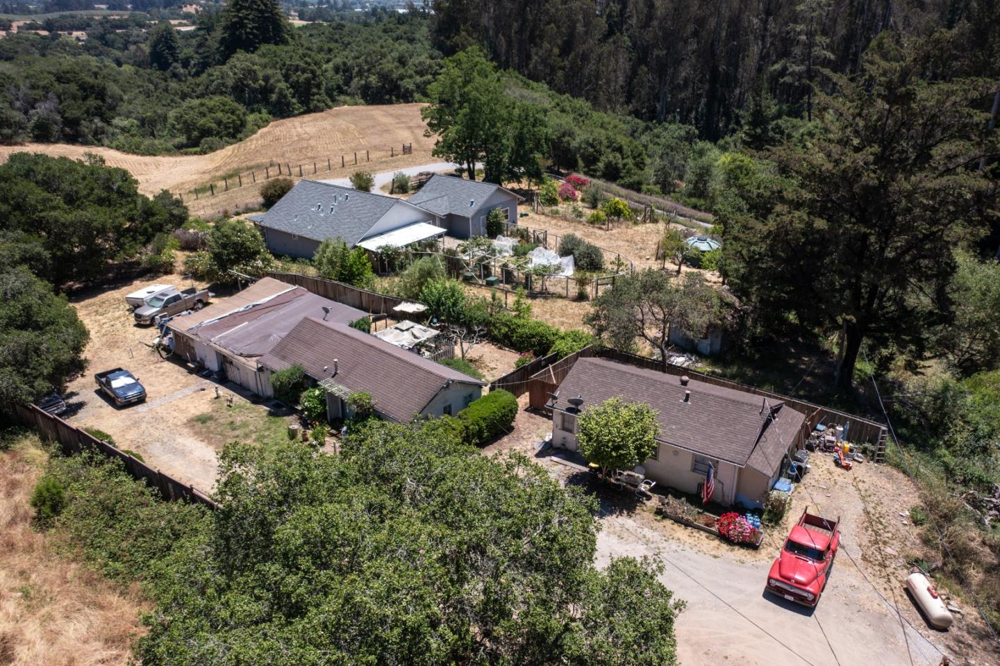 an aerial view of house with yard