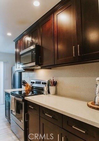 a kitchen with appliances cabinets and a sink