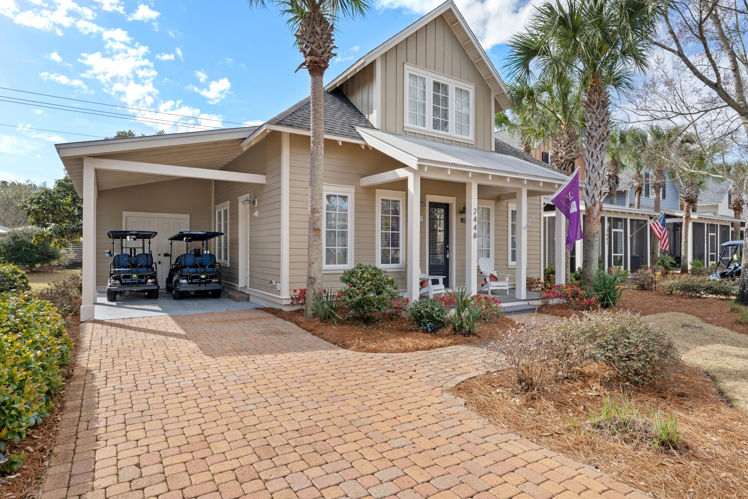 a view of a house with backyard and porch