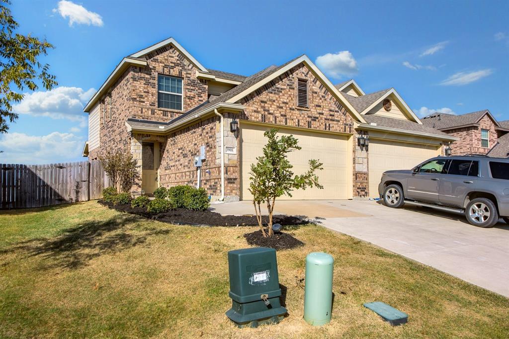 a front view of a house with parking area