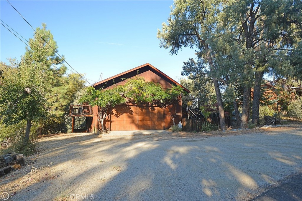 a view of a house with a tree