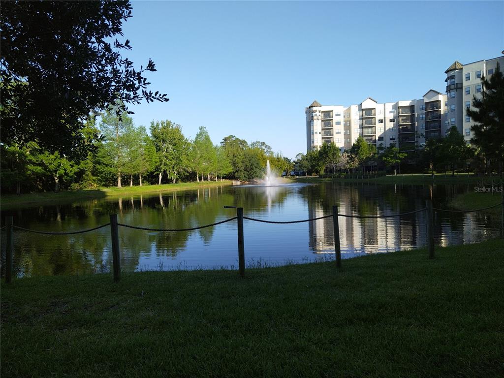 a view of a lake with a large building