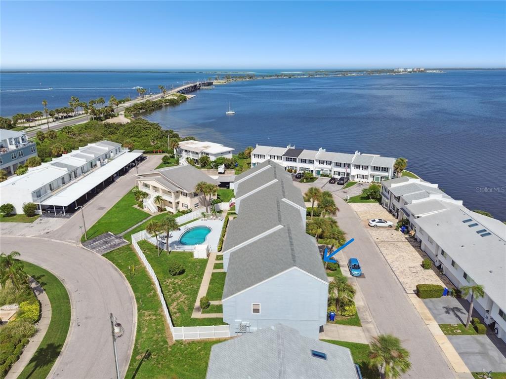 an aerial view of a house with outdoor space water view