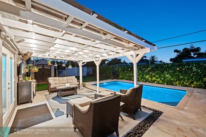 a view of a patio with a dining table and chairs