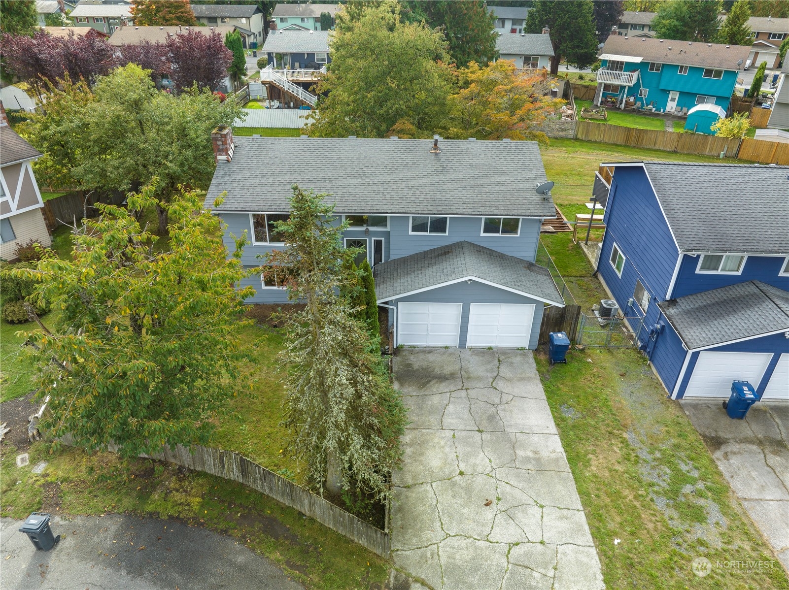 an aerial view of a house with swimming pool