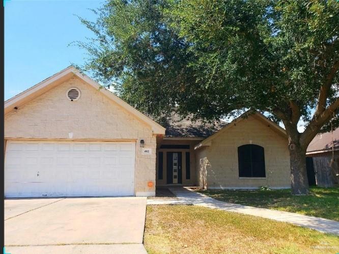 Single story home with a garage