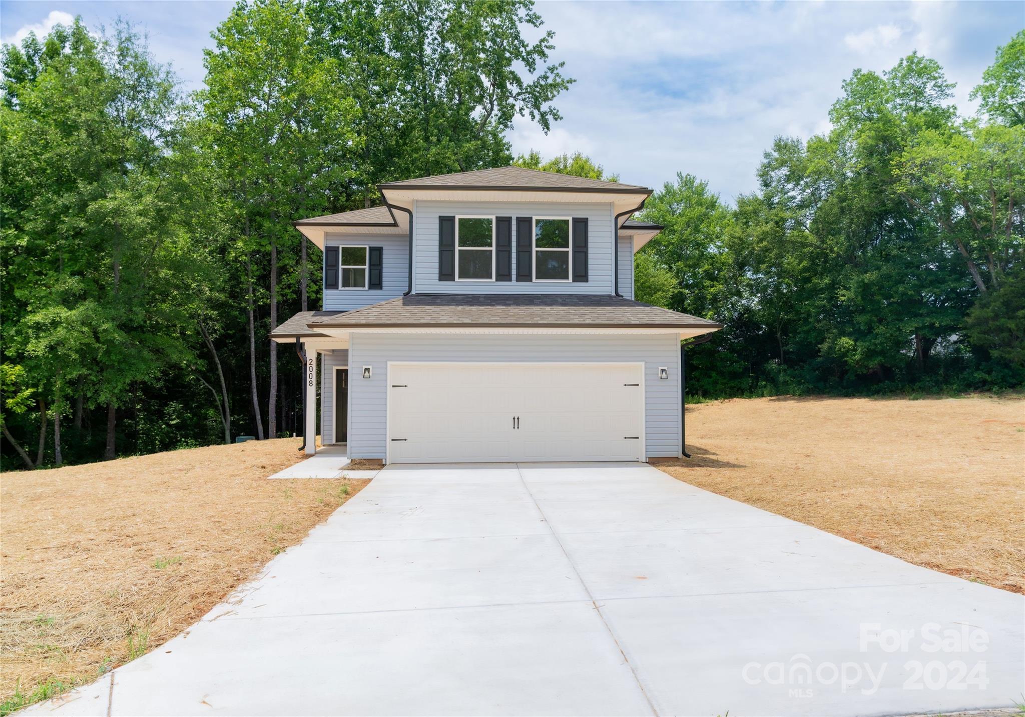 a front view of a house with a garage