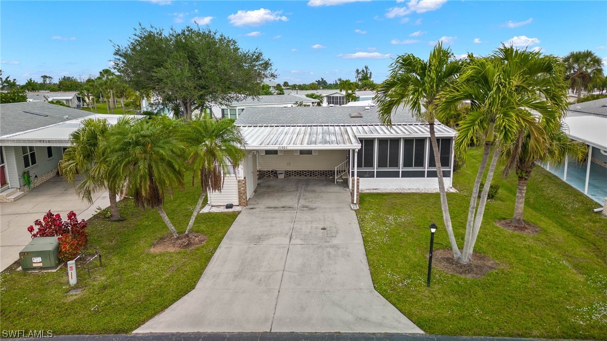 an aerial view of a house with swimming pool garden and patio