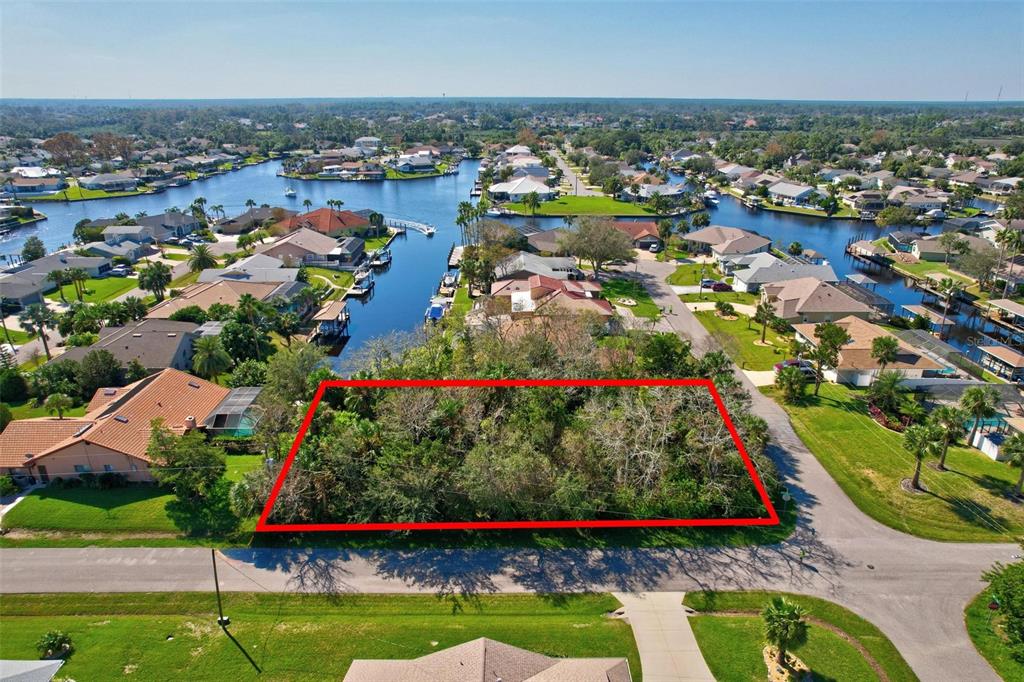 an aerial view of a houses with yard