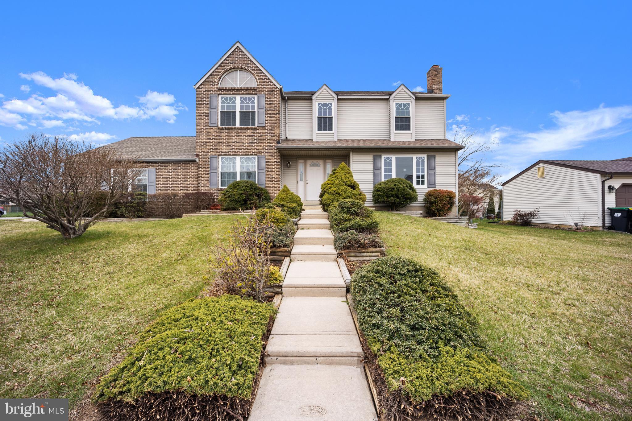 a front view of a house with yard