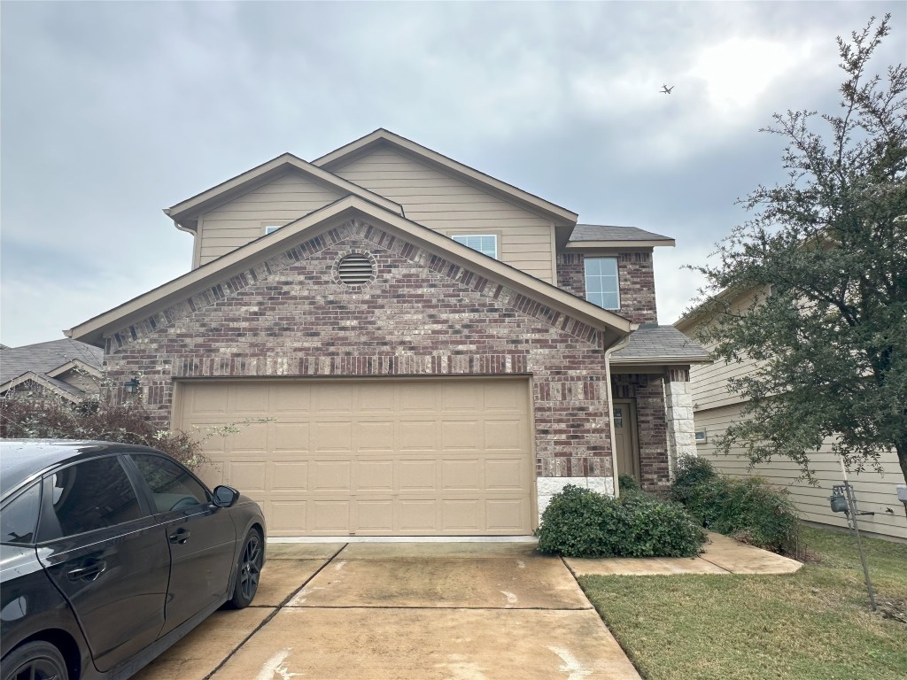 a view of a house with a garage