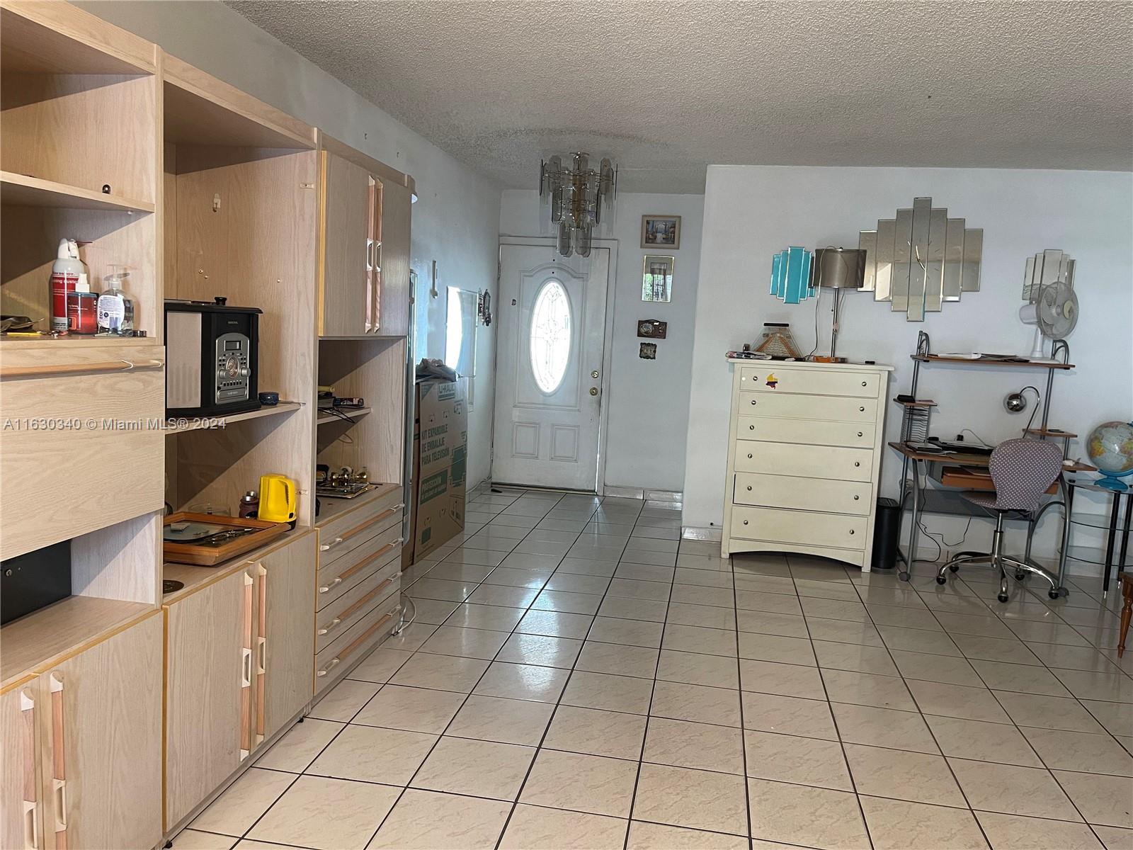 a room with cabinets and appliances