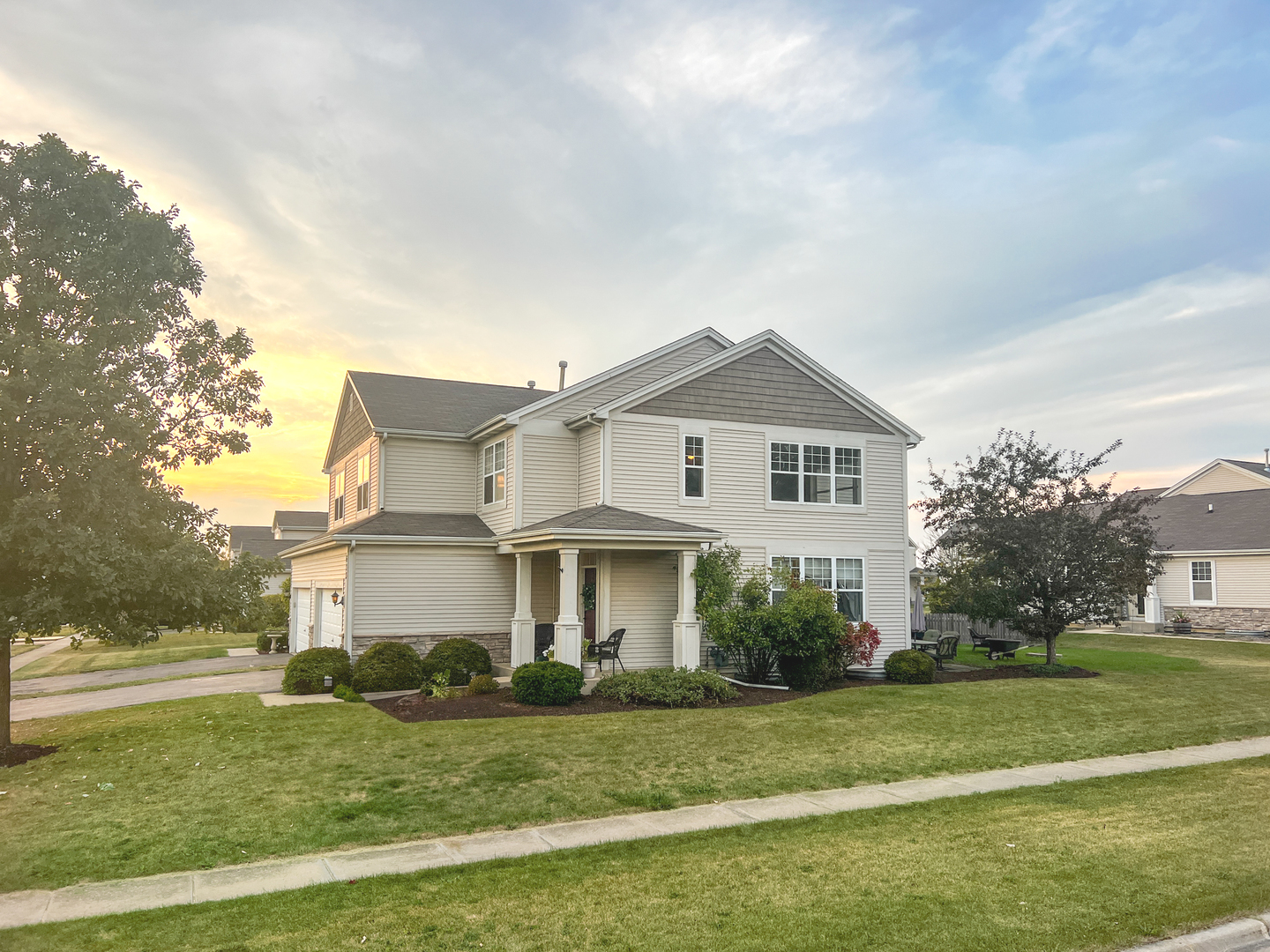 a front view of a house with a yard