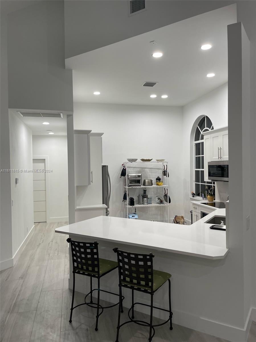 a kitchen with a table and chairs in it