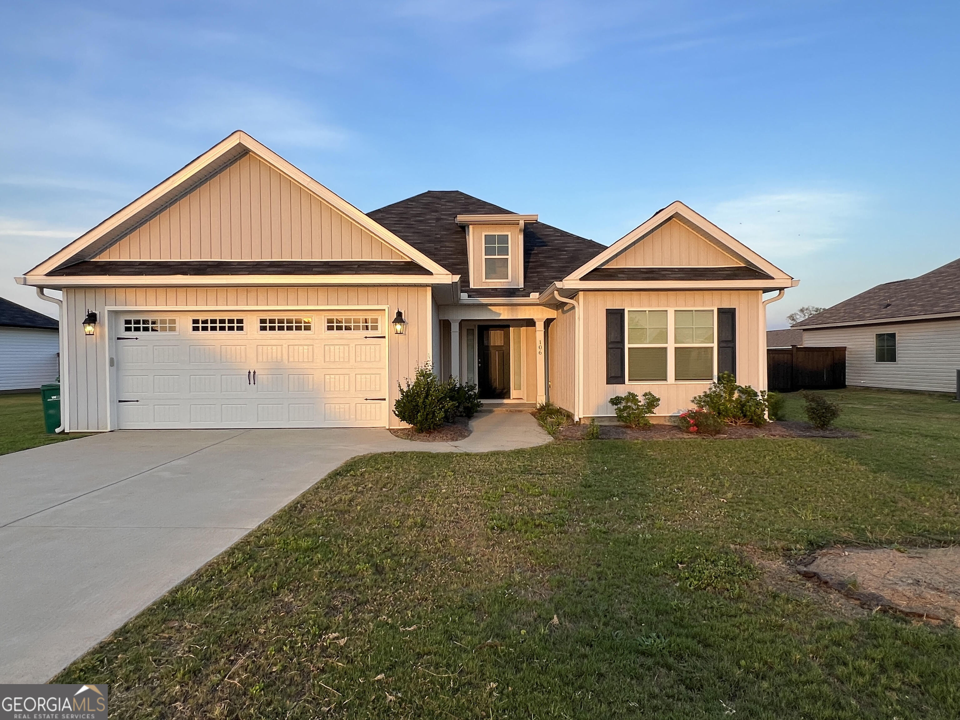 a front view of a house with a yard