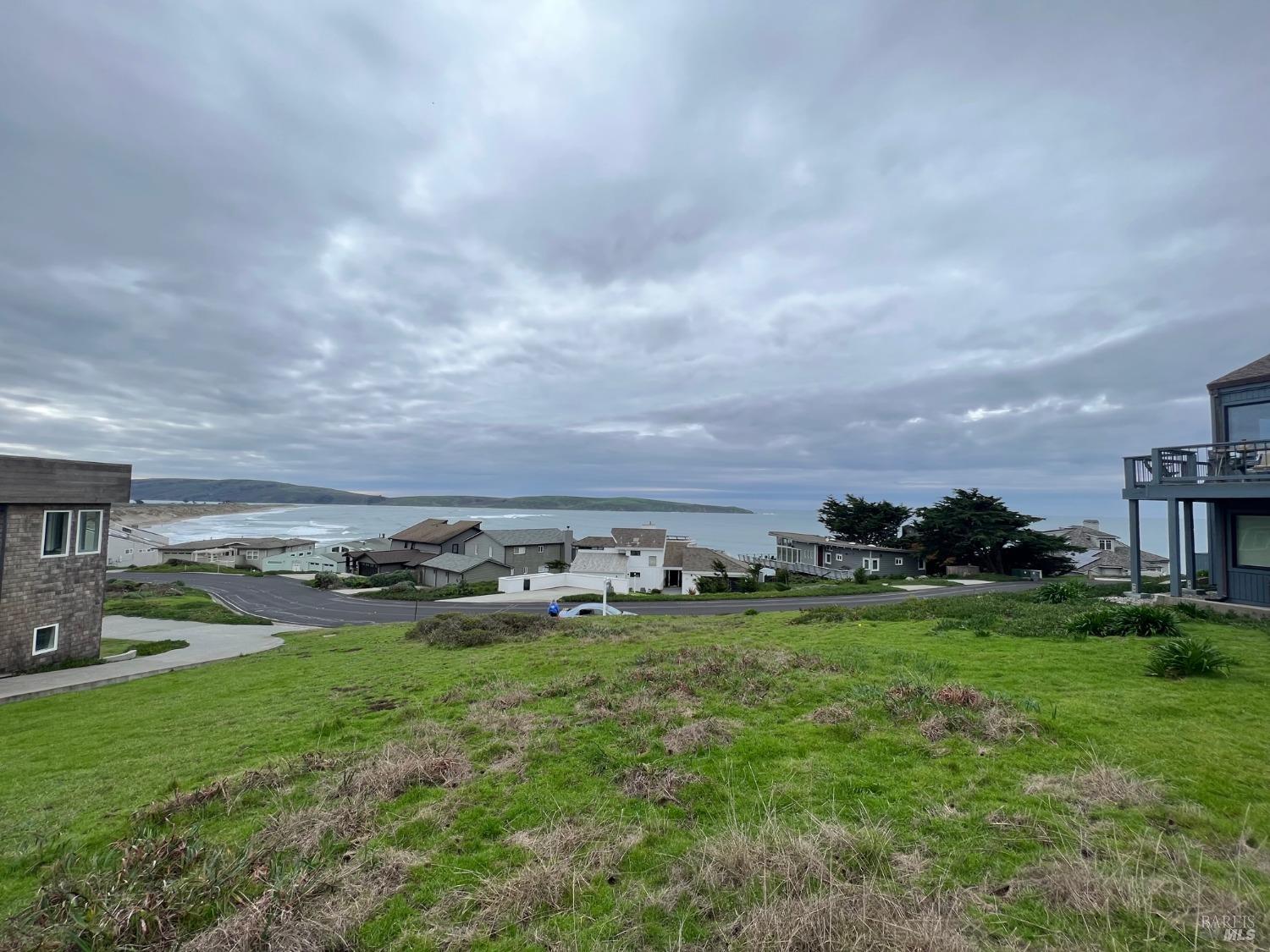 a view of a big yard with houses and a yard