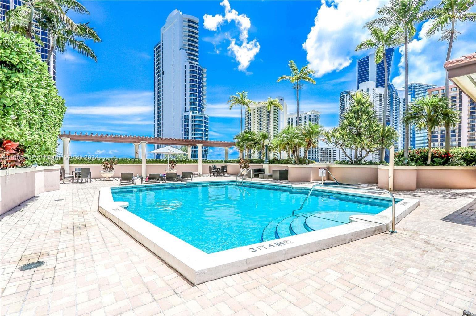 a view of swimming pool with outdoor seating