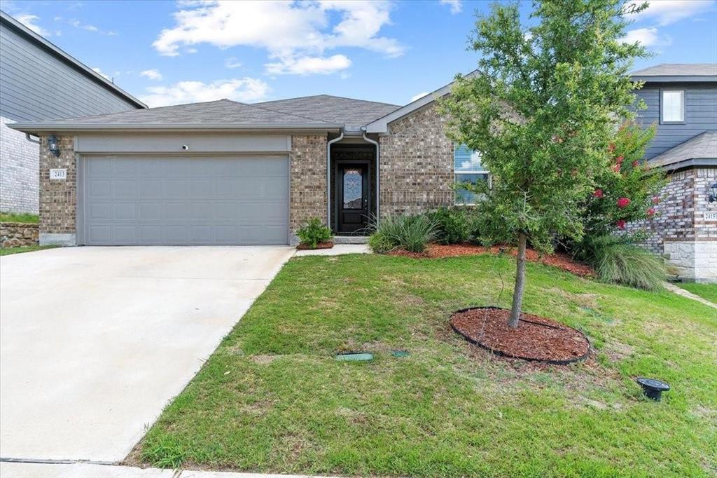 a house that has garden in front of it