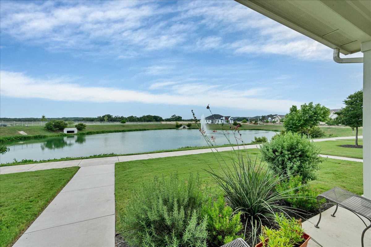 a view of a lake with a big yard