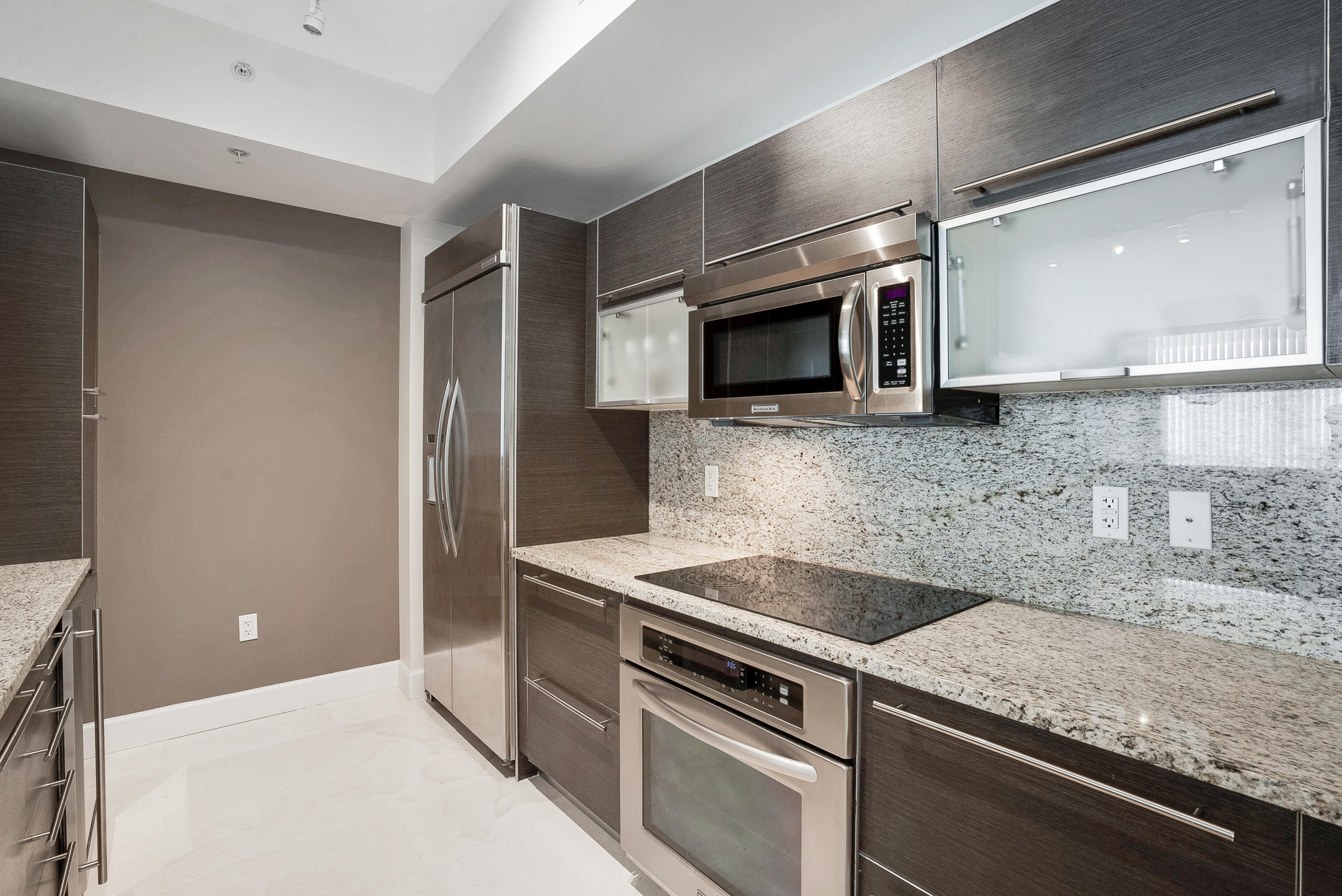 a kitchen with a stove and a microwave